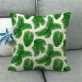 Close-up of linen pillowcase featuring vibrant green palm leaf print on a grey sofa - Palm Leaf Style (9)