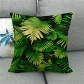 Detail of green fern leaf pattern on linen pillow cover displayed on a sofa - Fern Leaf Style (7)