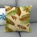 Detail of linen cushion cover featuring butterfly and tropical leaf patterns on a sofa - 18x18 Inch / Natural Butterfly Plant (17)