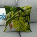 Macro detail of tropical banana leaf print on linen throw pillow case on a grey sofa - Bananas and Banana Leaves on Off-white (14)