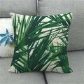 Detail of tropical monstera leaf print on linen blend cushion cover on grey fabric sofa - Full Print Palm Leaves on Off-white (12)