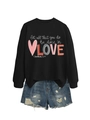 Detail of long sleeve sweatshirt with let all that you do be done in love text and denim shorts - Black Sweatshirt (White Text Pattern)