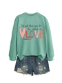 Flat lay of a mint green sweatshirt with inspirational quote and distressed denim shorts - Light Green Sweatshirt (Black Text Pattern)