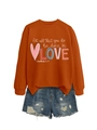Detail of orange crewneck sweatshirt with 'LOVE' print and frayed denim shorts - Burnt Orange Sweatshirt (White Pattern)