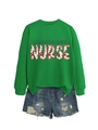 Detail of Labor & Delivery Nurse green sweatshirt with pink floral lettering and denim shorts - S / Grass Green
