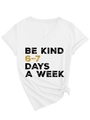 Detail of white V-neck T-shirt with 'Be Kind' print and front hem knot design - S / White (Black Graphics)