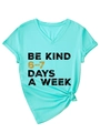 Detail of V-neck mint t-shirt with rolled sleeves and front hem knot featuring Be Kind print - S / Deep Water Blue (Black Graphic)