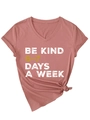 Close-up of Dusty Rose V-neck T-shirt featuring Be Kind 6-7 Days A Week graphic print - Rose Gold (White Graphics)