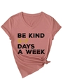 Detailed view of dust pink V-neck t-shirt with Be Kind print and side knot detail - Rose Gold (Black Graphics)