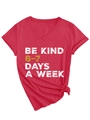 Detail of red V-neck T-shirt with vintage Be Kind print and stylish knotted hem - Red (White Graphics)