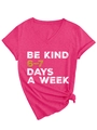 Detail of V-neck T-shirt in fuchsia featuring Be Kind 6-7 Days slogan and front knot design - Rose Red (White Graphics)