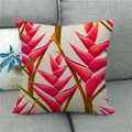 Linen square throw pillow cover featuring vibrant red tropical flower print on a grey sofa - Red Heliconia Flower Style (6)