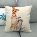 Linen cushion cover detail with cat, dog, and parrot print on a gray sofa - Pets Combo and Fish Tank Style