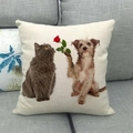 Detail of linen cat and dog Christmas pillowcase on grey sofa showing fabric texture - Warm Cat and Dog with Rose Style