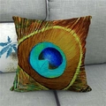 Linen cushion cover with vivid peacock feather eye pattern on a modern grey sofa - Electric Blue Gold Brown Feather Style 9 (9)
