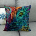 Close-up of linen cushion cover featuring vibrant peacock feather pattern on a gray sofa - High Saturation Full Print Style 18 (18)