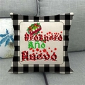 Detail of Christmas linen pillowcase with Feliz Navidad text on a grey fabric sofa - 18x18 Inch / Spanish Greeting Feliz Navidad (6)