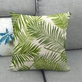 Linen square pillowcase with green palm leaf print on a cozy grey fabric sofa - 18x18 Inch / Beige Green Palm (13)