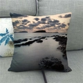 Linen throw pillow with seaside scenery and coastal rocks on a grey fabric sofa - Realistic Wave Rocks Sunset Style (4)