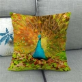 Linen cushion cover featuring a vibrant peacock feather print on a gray fabric sofa - 45x45cm / Realistic Open Tail Peacock Style (4)