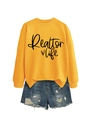 Detail of Realtor Life sweatshirt in yellow paired with distressed denim shorts - Yellow (Black Font)