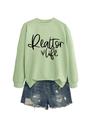 Detail of Realtor Life print on light green sweatshirt with distressed denim shorts - Olive Green (Black Font)