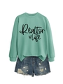 Detail of mint green Realtor Life sweatshirt paired with distressed denim shorts - Light Green (Black Font)