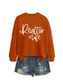 Flat lay of orange Realtor Life sweatshirt paired with distressed blue denim shorts - Burnt Orange (White Font)