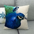 Linen cushion cover with high-definition peacock head print on a modern grey sofa - High Definition Side Peacock Detail