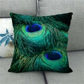 Close-up of peacock feather print on linen pillowcase against a grey sofa background - 45cmx45cm / Royal Blue Eye Pattern Print (4)