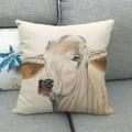 Square beige cotton linen pillowcase featuring a realistic bull animal print on sofa - Partial Bull Head Painting (4)