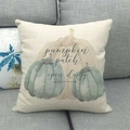 Detail of linen pillow cover featuring watercolor pumpkin graphics and festive text - 18x18 Inch