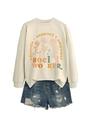 Flat lay of cream sweatshirt with floral text and blue distressed denim shorts - S / Sand