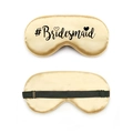 Detail of champagne gold silk bridesmaid eye mask with black adjustable strap and heart logo - Champagne Gold #Bridesmaid with Heart (Style 6)