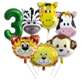Close-up of jungle animal head foil balloons and a green number 3 balloon for party decor - Number 3