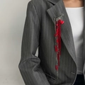 Elegant long red bead tassel brooch with heart charm pinned on a grey striped suit jacket - Red Heart Multi Layer Tassel Style (00364)