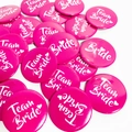 Magenta Team Bride badges with white script and heart for bridal party decorations - Pink Team Bride (Heart Icon)