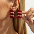Macro detail of triple-layered burgundy resin drop earrings with golden metal rings - Gold Deep Red Triple Layer Stacked Retro Stud Earrings (03862)