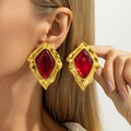 Close-up of vintage gold hammered earrings with large red resin diamond centerpiece - Gold Irregular Hammered Red Diamond Stud Earrings (03863)