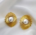 Vintage golden spiral vortex earrings with large white pearls on a white silk surface - Gold