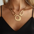 Gold minimalist geometric hollow pendant necklace worn on neck by a fashion model - Geometric Ring Necklace / Gold (07604)