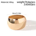Detailed view of polished gold alloy wide cuff bracelet with 8cm diameter and 74.6g weight - Polished Gold Metal Style (JS02681)