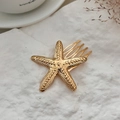 Golden starfish hair comb with realistic textured surface for beach wedding hairstyles - Starfish Shape / Gold