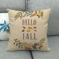 Detail of Hello Fall linen pillowcase with maple leaves and acorns on a grey sofa - Hello Fall Pine Cone Style (10)