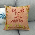 Detailed close-up of pink linen pillowcase featuring a grateful heart quote on a sofa - Grateful Heart Inspirational Style (14)