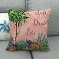 Close-up of linen pillowcase featuring tropical palms and Love Dream Live artistic text - Love Dream Live Illustration Style (16)
