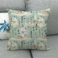 Close-up of linen pillowcase with forest cabin pattern on a gray fabric sofa - Forest Cabin and Snow Style (5)