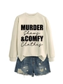 Detail of Murder Shows and Comfy Clothes sweatshirt paired with distressed denim shorts - Sand (Black Font)