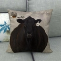 Artistic bull cotton linen throw pillow cover with bird and Hope tag on grey sofa - 45x45cm / Black Bull with Bird HOPE (4)
