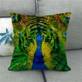 Detail of linen pillowcase featuring a vibrant peacock feather pattern on a gray sofa - Center Symmetrical Peacock Feather Eye (17)
